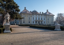 Slavkov Castle view from its park with trees